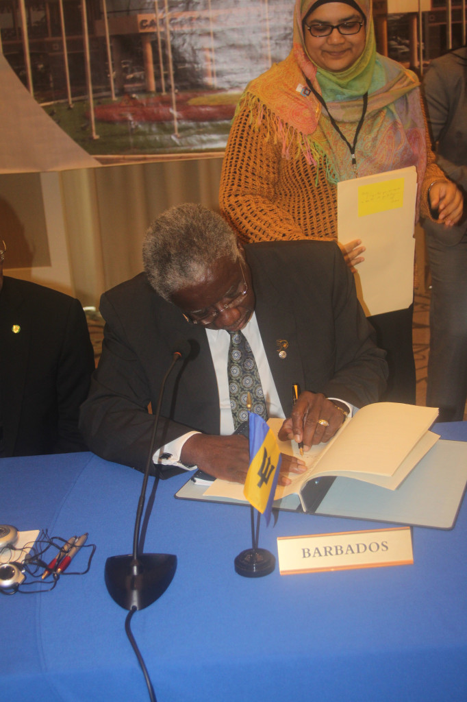 Prime Minister of Barbados, the Hon Freundel Stuart signs the agreement