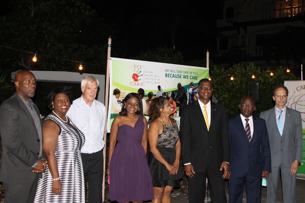 From left: Mr Weseley Clerveaux, PS, Ministry of Health, Hon. Rhondalee Braithwaite-Knowless Attorney General, TCI, His Excellency Governor Peter Beckingham, Dr Shandey Malcolm, TCI THP Coordinator, Dr. Lisa Indar Head, Tourism and Health Programme, CARPHA, Dr. Rufus Ewing Premier and Minister of TCI, Hon Robert Hall, Speaker of the House, TCI, Dr. C. James Hospedales Executive Director, CARPHA (Photo via CARPHA)
