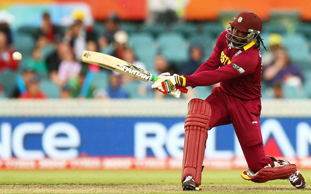 Chris Gayle of the West Indies bats during the 2015 ICC Cricket World Cup match between the West Indies and Zimbabwe at Manuka Oval on February 24, 2015 in Canberra, Australia. (Photo via WICB) by Mark Nolan-IDI/IDI via Getty Images)