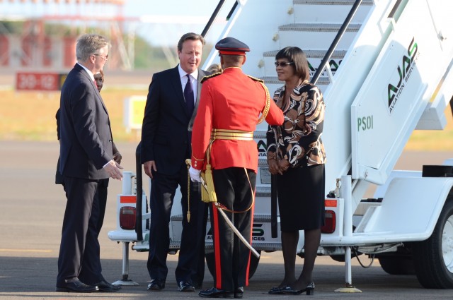 Prime Minister, the Most Hon. Portia Simpson Miller (right), looks on as Chief of Defence Staff, Major General Antony Anderson is introduced to Prime Minister of the United Kingdom (UK), the Rt. Hon. David Cameron (third right), by British High Commissioner to Jamaica, His Excellency David Fitton (left). Prime Minister Cameron arrived at the Norman Manley International Airport in Kingston, today (September 29) for a two-day official visit (Photo via Jamaica Information Service)