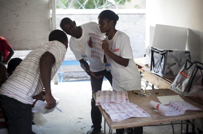 Electoral workers count ballots at a polling station in Port-au-Prince, Haiti, October 25, 2015. (Photo via REUTERS/Jeanty Junior Augustin)