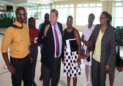 Prime Minister Dr ralph Gonsalves (centre) at a visit to the airport on Wednesday (Photo via CMC)