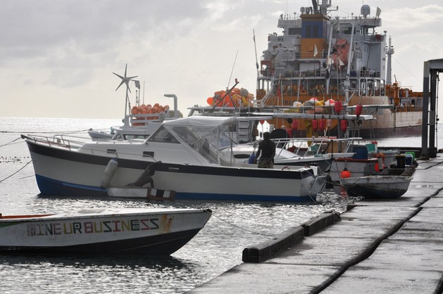Grenadian fishermen prepare to head out to sea. They say they have been catching less fish and their livelihoods are threatened by climate change. (Photo via Desmond Brown/IPS)