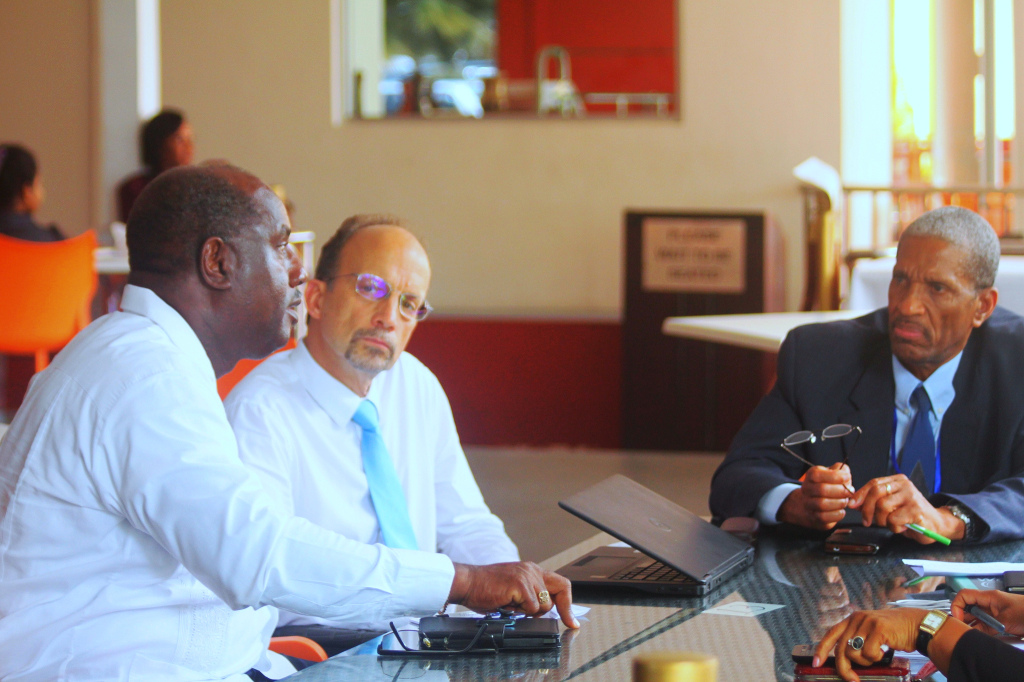 From left, Dr. Rudolph Cummings, Programme Manager, Health Sector Development, CARICOM Secretariat, Dr. James Hospedales, Caribbean Public Health Agency (CARPHA) Executive Director, and Assistant Secretary-General, Human and Social Development, CARICOM Secretariat, Dr. Douglas Slater in discussion on Wednesday at the Pegasus Hotel, Georgetown, Guyana.