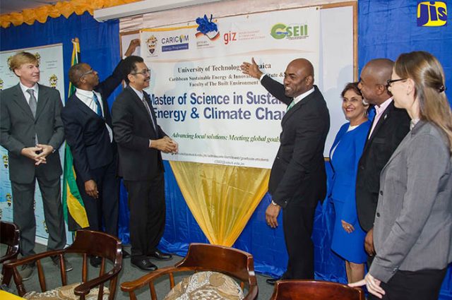 Minister of Science, Energy and Technology, Dr. the Hon. Andrew Wheatley (centre), officially launches the Sustainable Energy and Climate Change Master’s Degree Programme at the University of Technology (UTech), yesterday (March 2) at the school’s Papine campus. Others (from left) are Charge d’Affaires at the German Embassy, Michael Dumke; Dean, Faculty of the Built Environment at UTech, Dr. Garfield Young; President of UTech, Professor Stephen Vasciannie, CD.; UTech’s Sustainable Energy Head, Dr. Ruth Potopsingh; Manager, Energy, CARICOM Secretariat, Dr. Devon Gardner, and Representative from the German Society for International Cooperation (GIZ) in the Dominican Republic, Anya Shwerwin. (Photo via JIS)