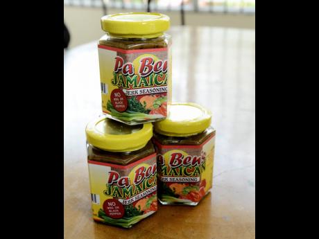 In this April 2015 file photo jars of the locally made Pa Ben Jamican Jerk Seasoning is displayed. (Photo via Jamaica Gleaner)