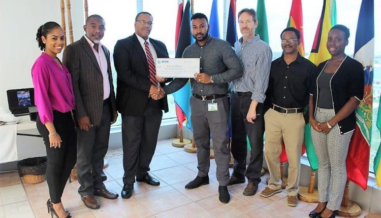 ASG presents checque to Keron Bruce in group photo