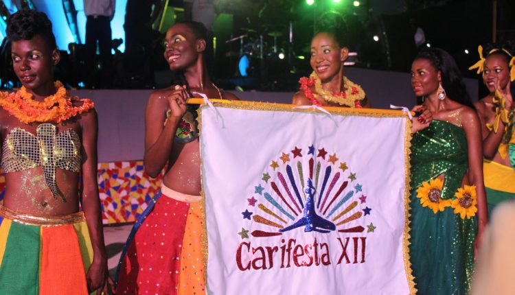 CARIFESTA XII – Ladies with banner