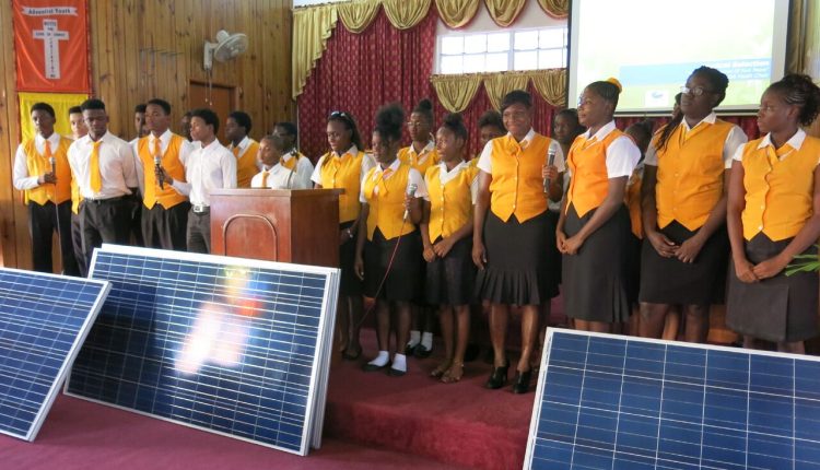 CEM Personality – Ruth Spencer students in front of panels