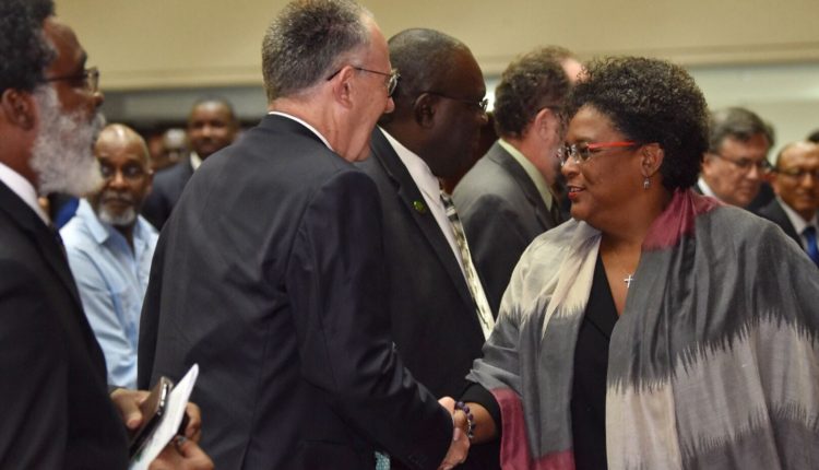 CWA Opening – PM Mottley greets a delegate