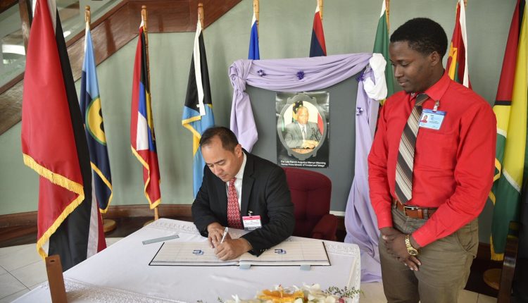 Charles Jong signs Manning condolence book