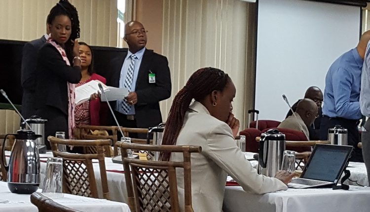 Delegates in discussion before start of the meeting