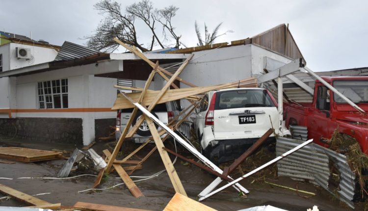 Dominica Hurricane Maria damage to house and cars
