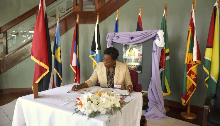 Dominica PS signs condolence book1