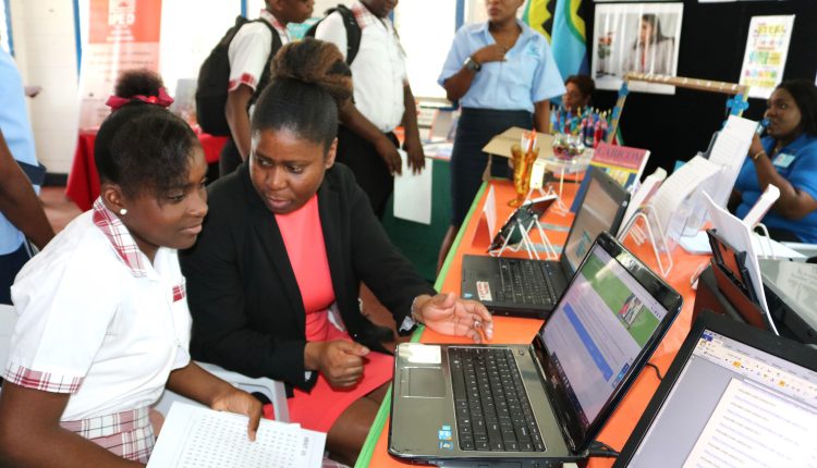 Girls in ICT GT CC’s SImon assists student