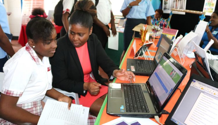 Girls in ICT GT CC’s SImon assists student cropped