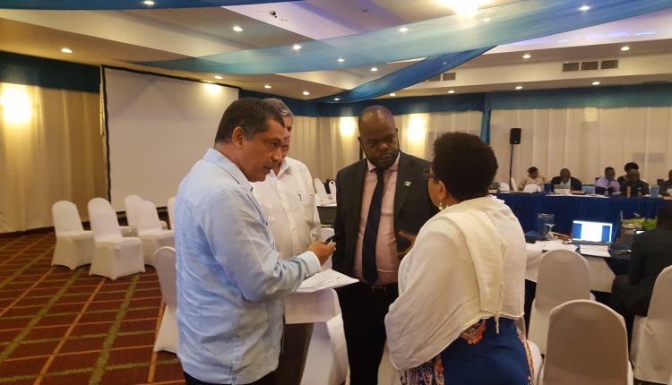 IICA reps in discussion with other delegate 2 Oct COTED Officials