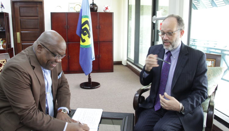 PM Harris signs SG’s Guest Book
