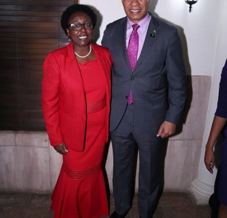 PM Holness with CARICOM national in South Africa- lady in red