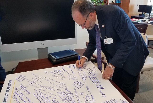 SG signs terrorism poster at UN