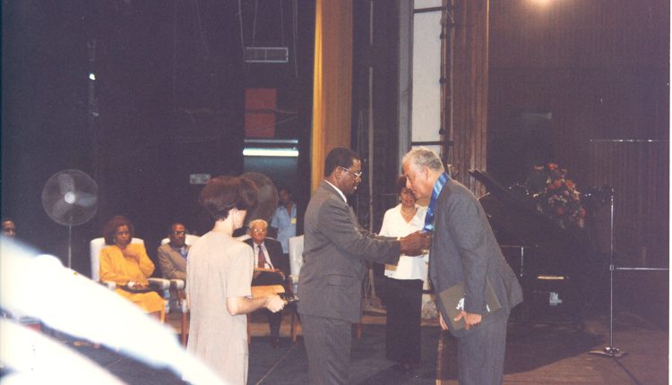 Sir Alister receiving the OCC