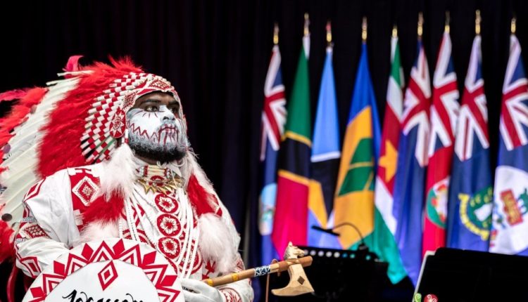 TT CARIFESTA launch costumed man and flags